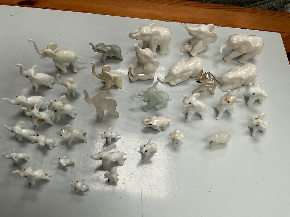Lot 268: A Collection of Thirty-eight Miniature Glass and Ceramic Elephant Figurines