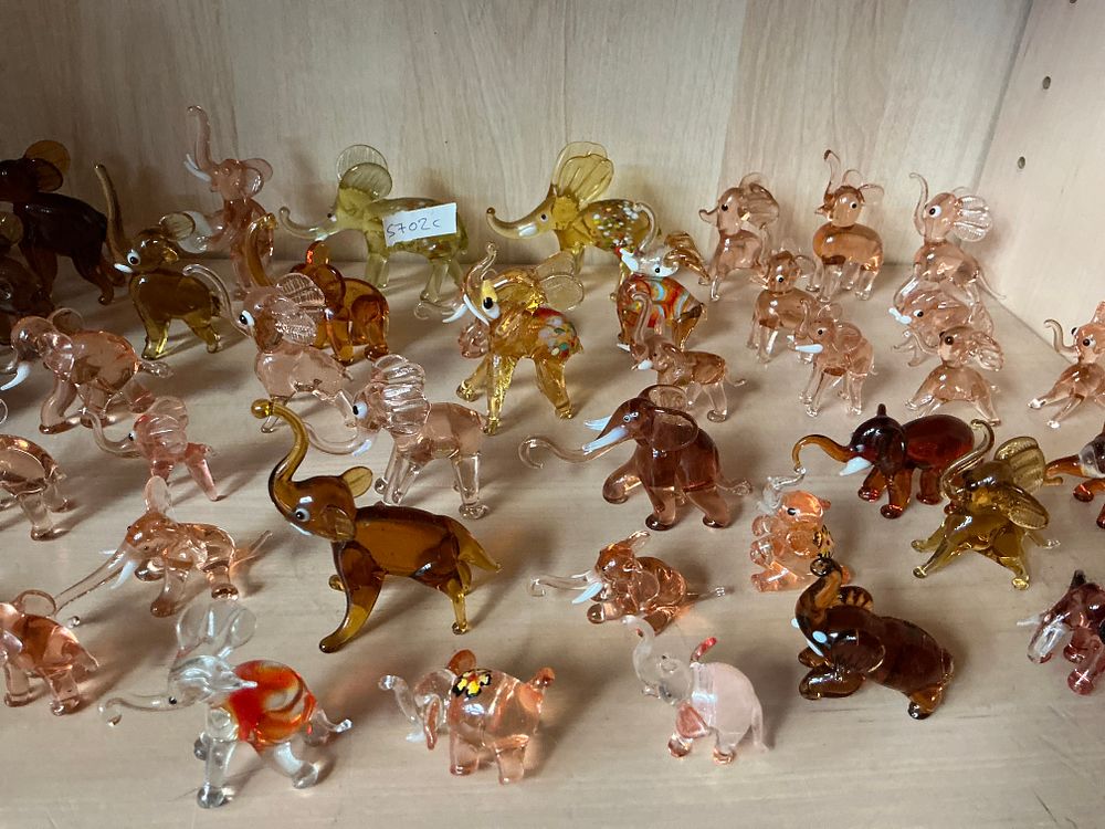 Lot 285: A Collection of Approximately 50 to 60 Hand-Blown and Lampworked Glass Elephant Figurines