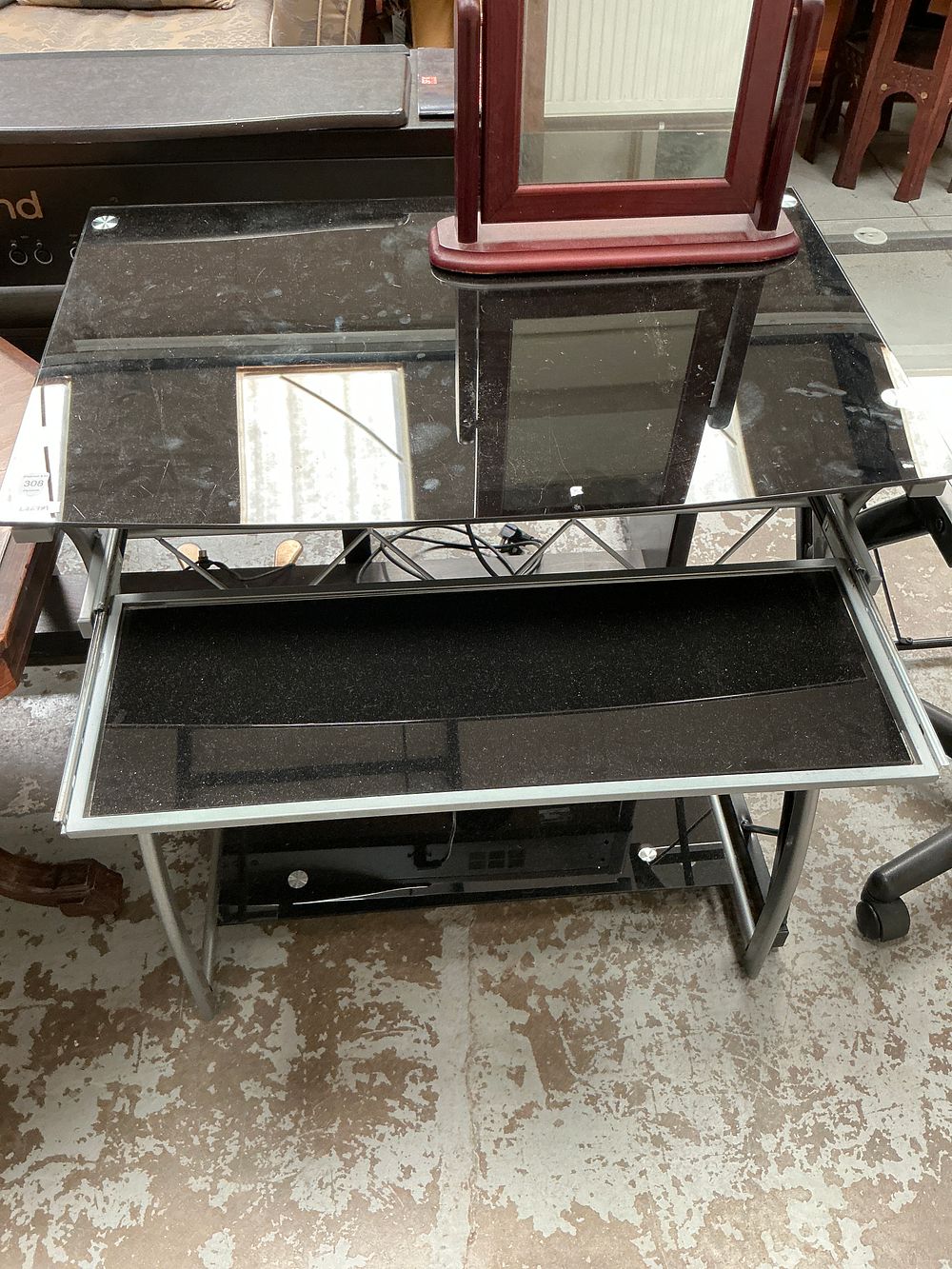 Lot 308: A contemporary black glass and silver-toned metal computer workstation desk