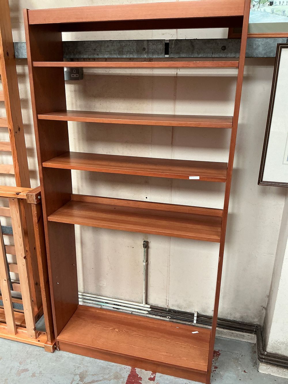 Lot 318: A Danish Modern Style Teak Effect Low Level Shelving Unit