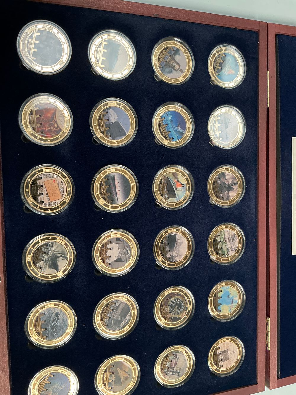 Lot 338: A Limited Edition 2022 Twenty Four Titanic Commemorative Gold-Layered Copper Medallion Collection in Case