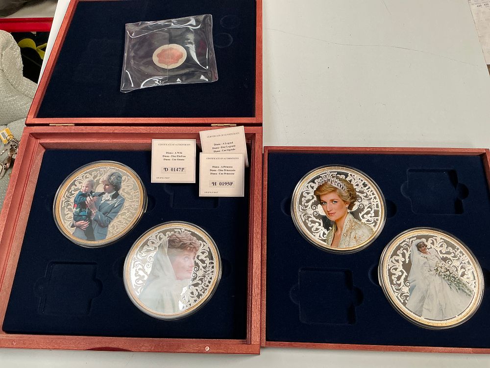 Lot 341: A Collection of Four Silver and Gold-Toned Princess Diana Commemorative Medallions in Wooden Cases