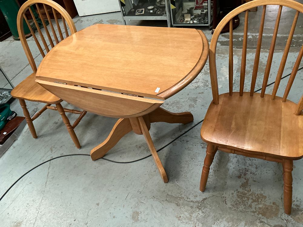 Lot 351: A Mid-Century Modern Windsor Style Dining Suite comprising a Drop-Leaf Pedestal Table and a Set of Two Chairs