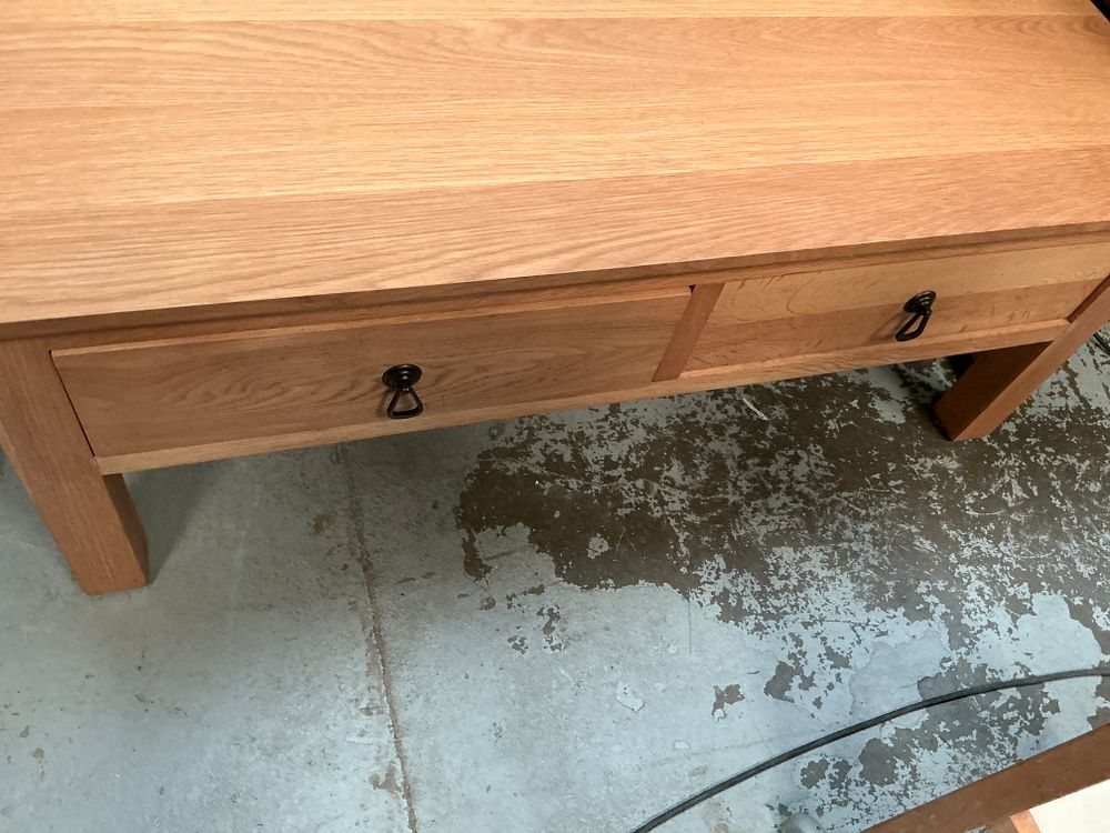 Lot 353: A contemporary solid oak two drawer coffee table