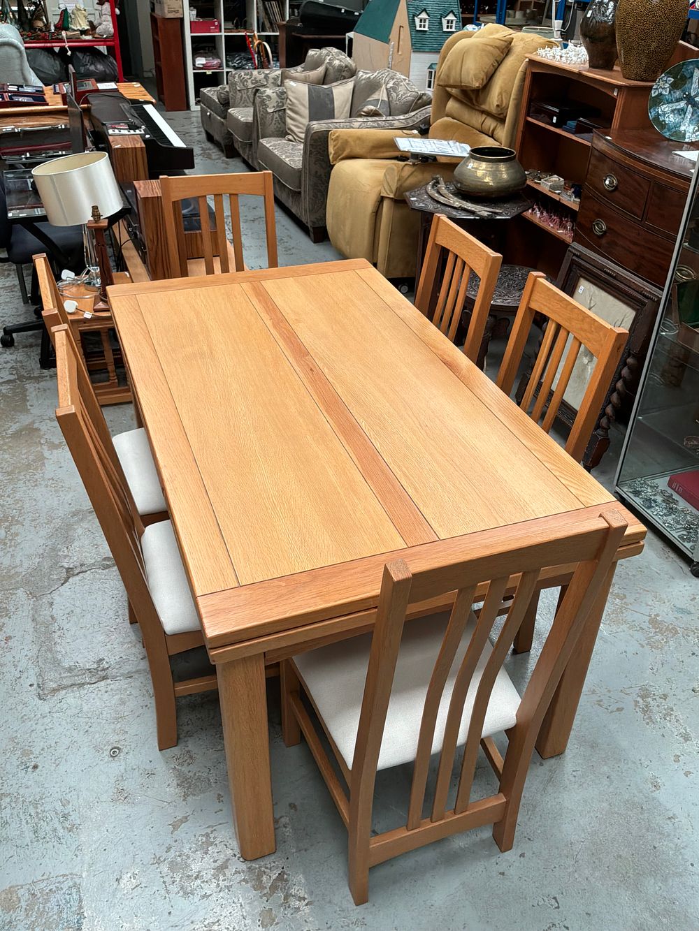 Lot 298: A Contemporary Mission Style Solid Oak Extending Dining Table and a Set of Six Matching Chairs