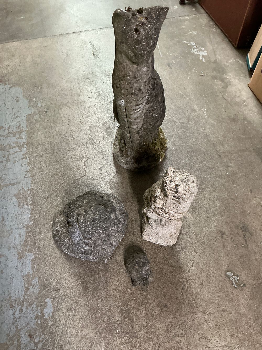 Lot 371: A Set of Four Weathered Reconstituted Stone Garden Ornaments