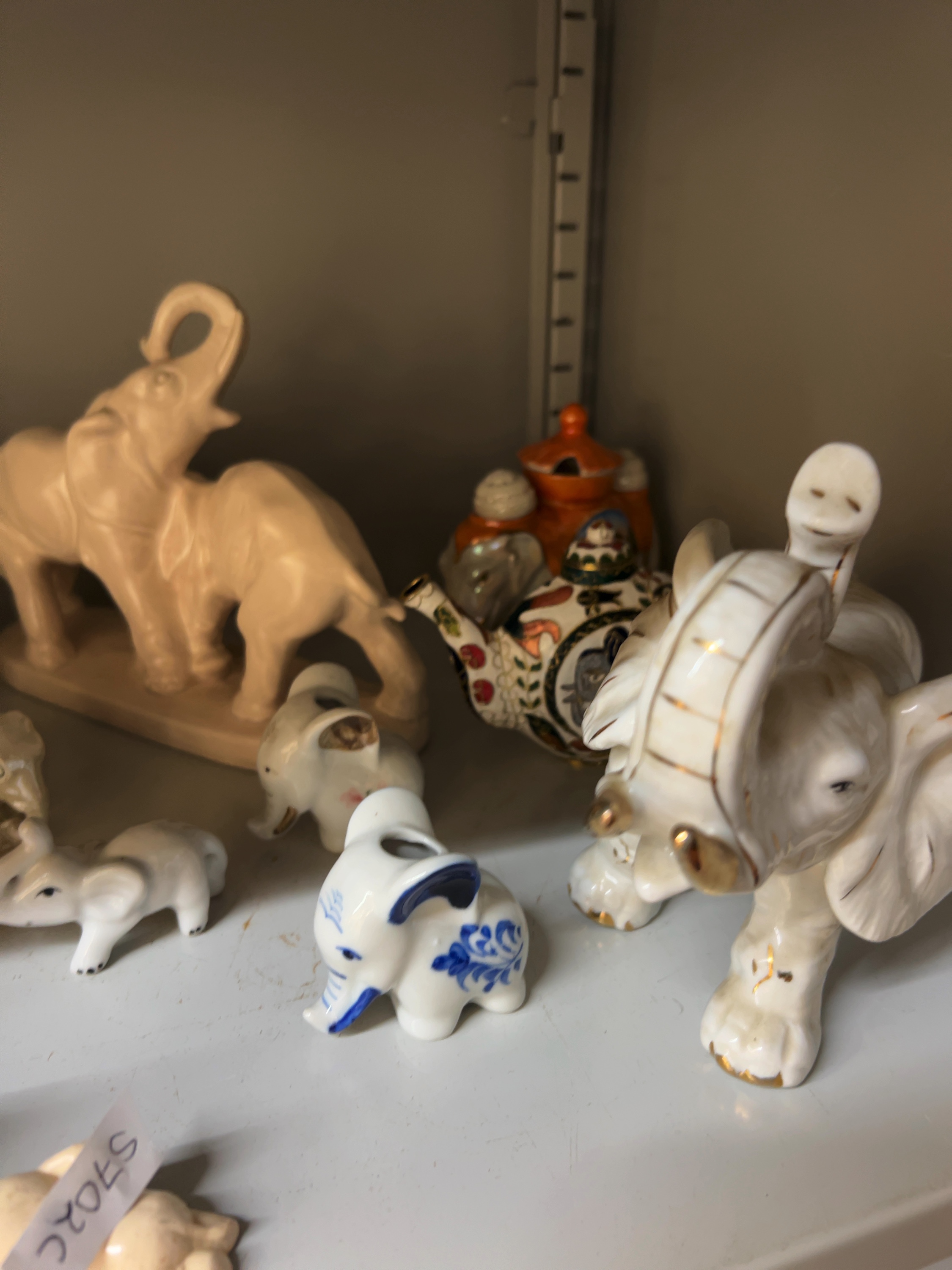 A Collection of Porcelain and Earthenware Elephant Figurines in Naturalistic and Modernist Styles