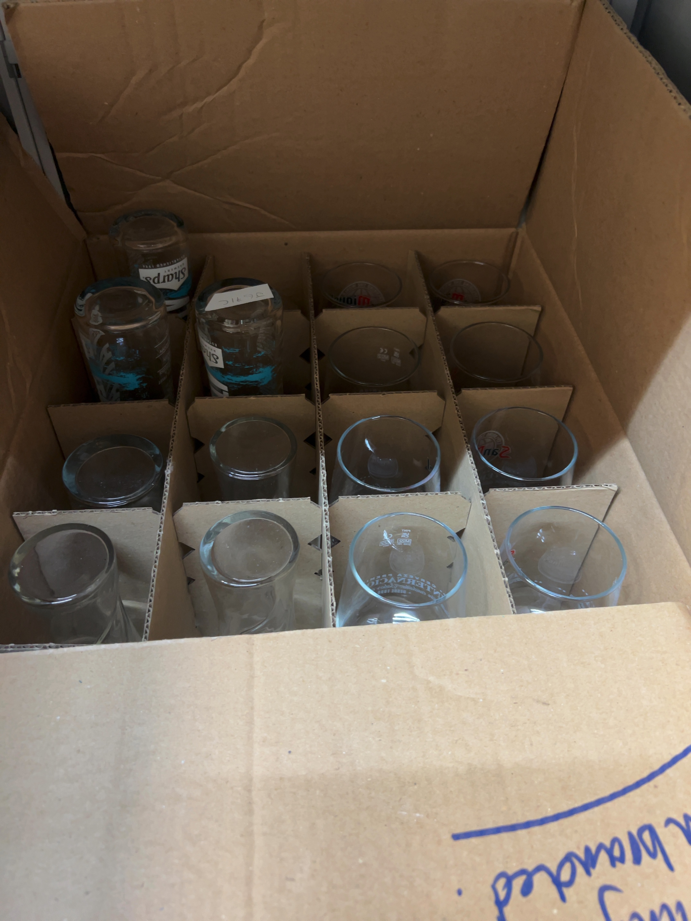 A Collection of Brewery style Glassware including Stemmed Glasses and pint glasses.