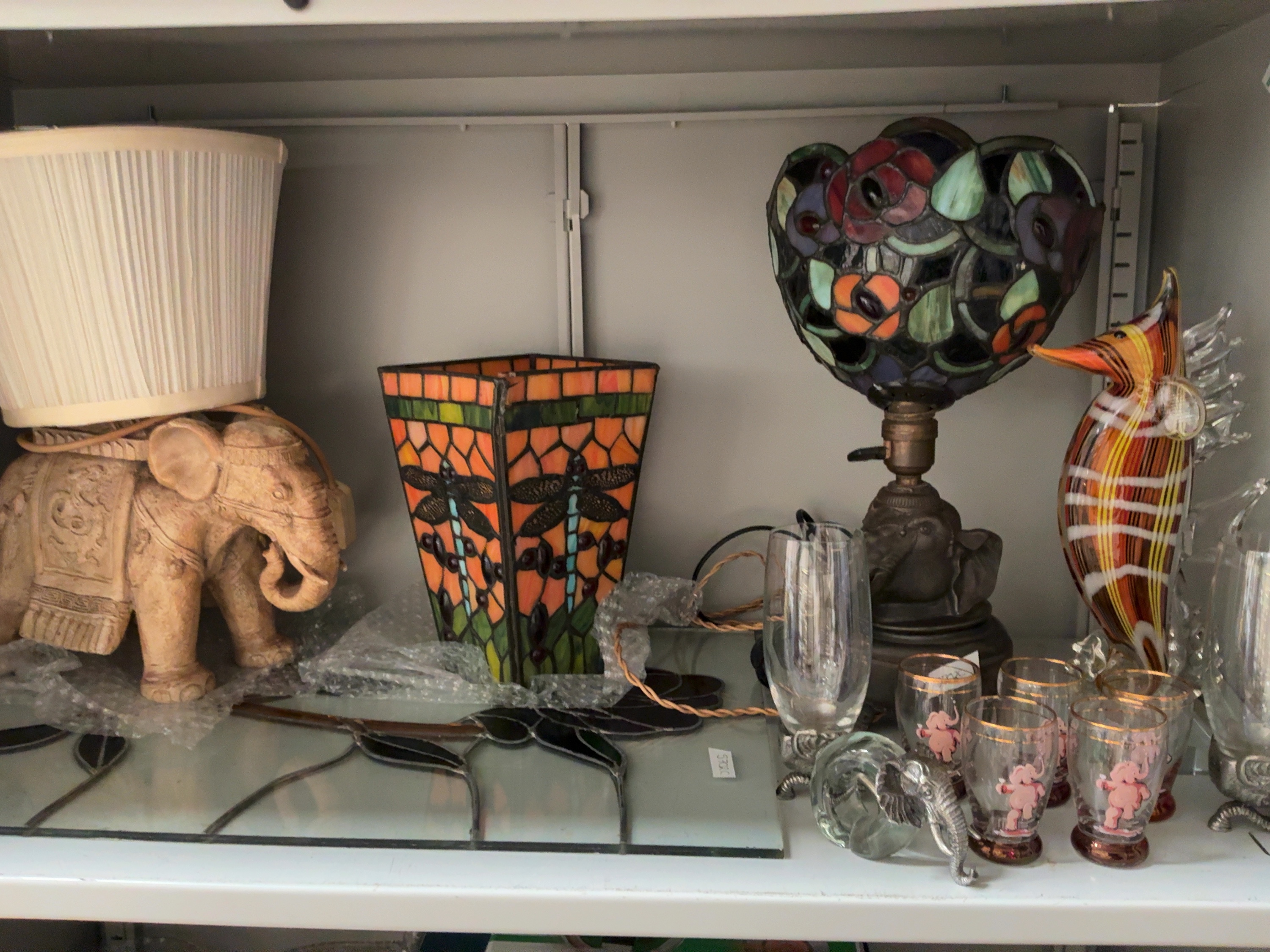 An Assortment of Decorative Stained Glass Lamps and Elephant Themed Ornaments including Widdop Bingham and Co. Ltd.