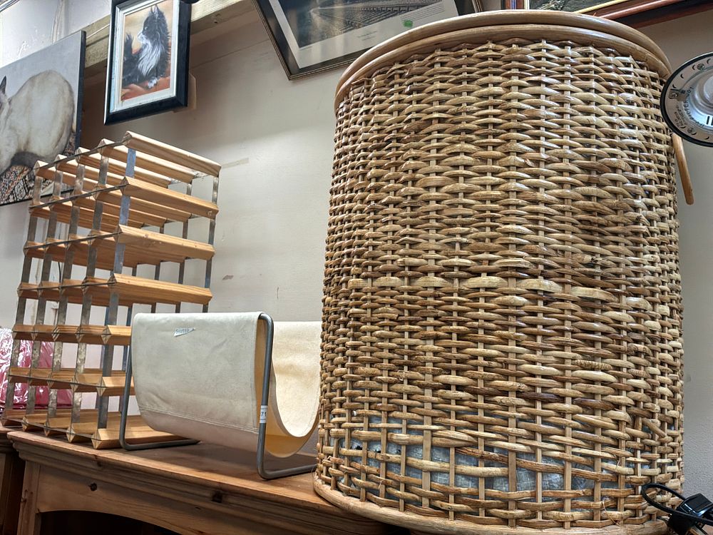 Lot 171: A Trio of Household Utility Items comprising a Wicker Basket a Wine Rack and a Canvas Magazine Rack