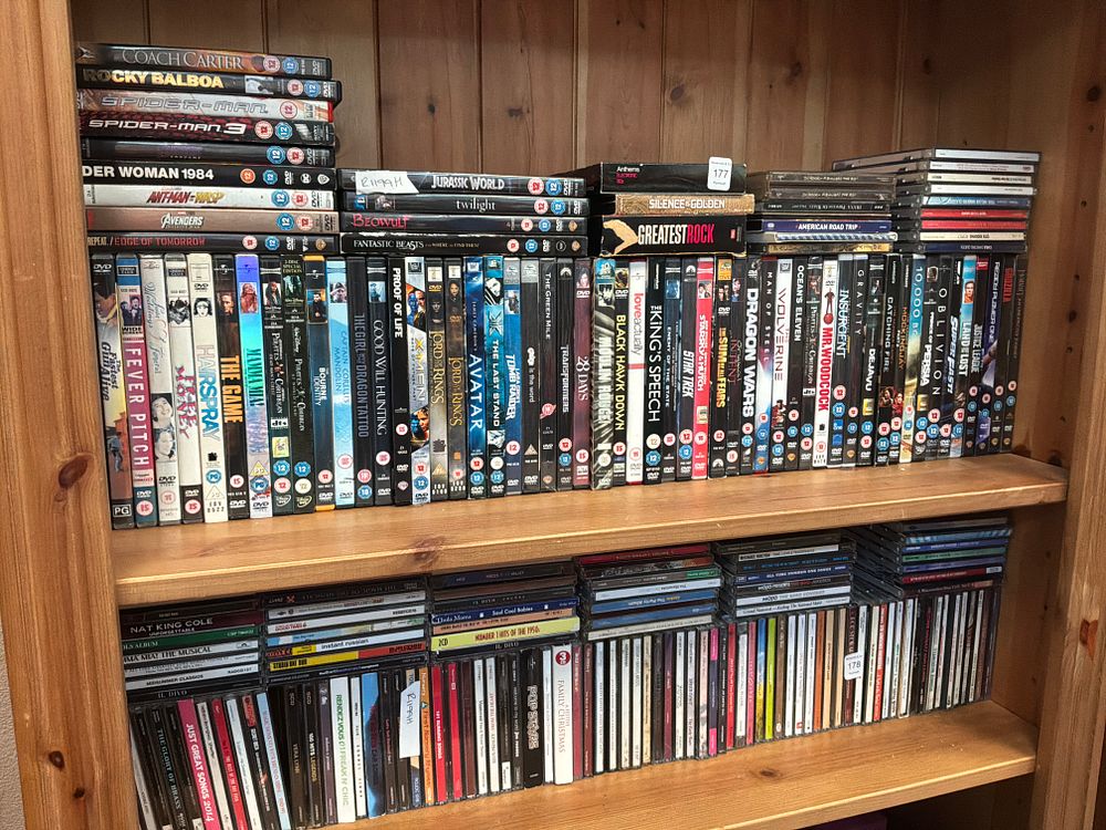 Lot 177: A Collection of Assorted Plastic Cased DVDs and Music CDs Including Lord of the Rings and Cher Examples