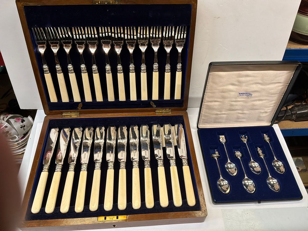 Lot 178: A Group of Two Cased Sets of Silver Plated Cutlery comprising Twenty Four Fish Pieces and Six Exquisite Souvenir Spoons