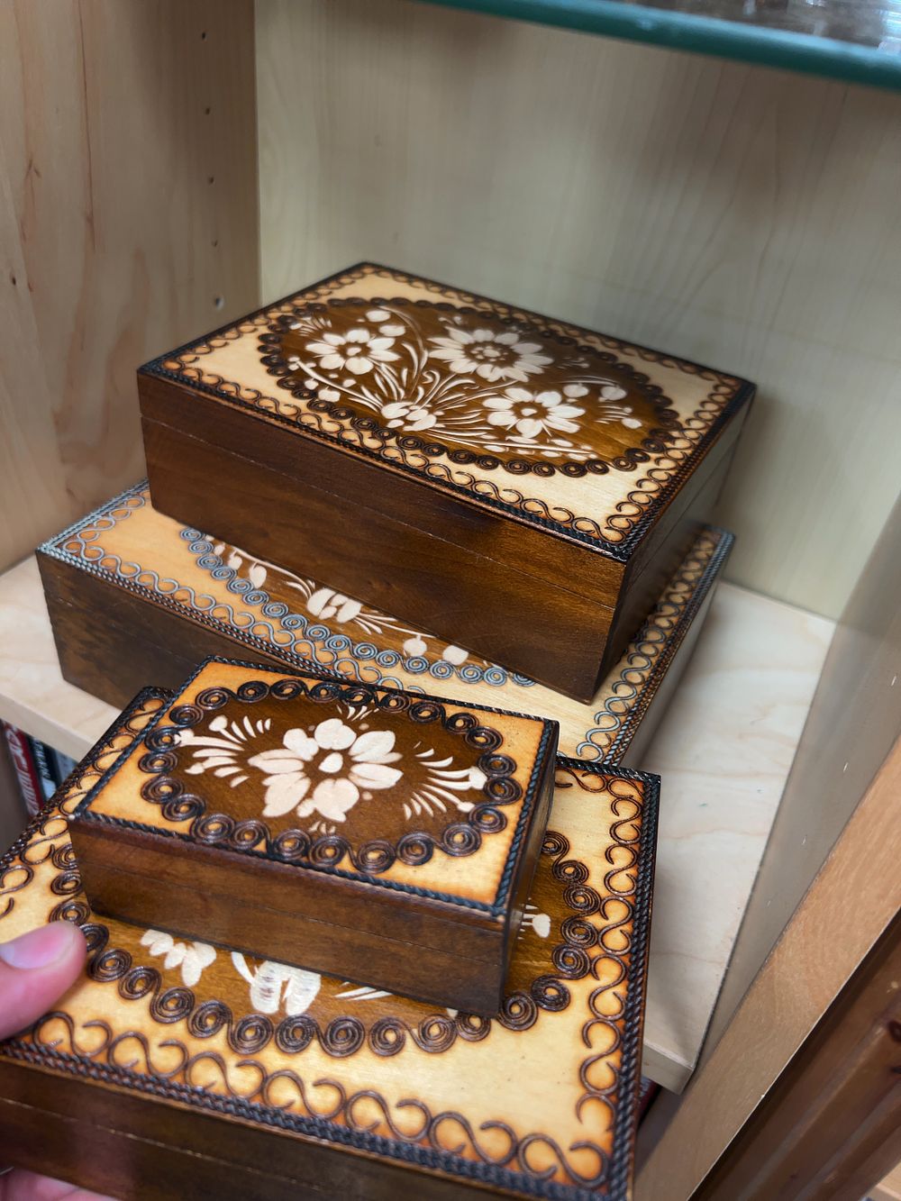 Lot 183: A Set of Four Polish style Decorated Wooden Nesting Boxes
