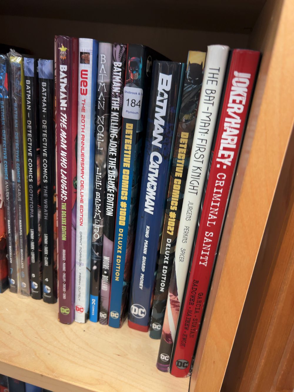 Lot 184: A Collection of Batman and Other DC Books Including Deluxe and Black Label Graphic Novels