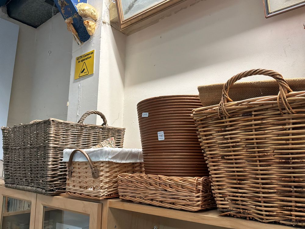 Lot 193: An Assortment of Wicker and Coiled Reed Household Storage Baskets and a Planter
