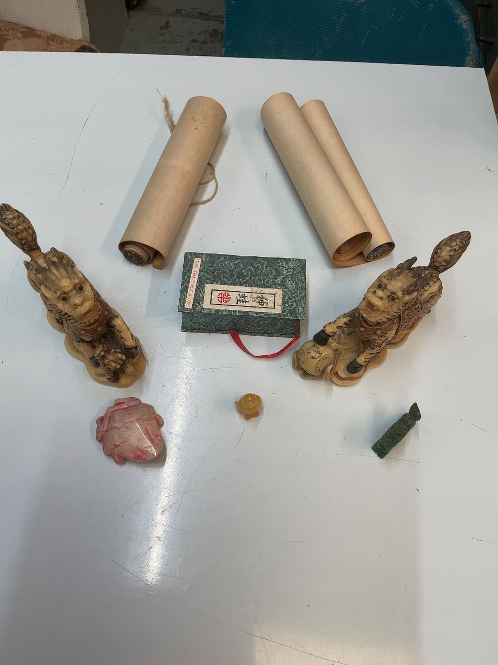 Lot 212: A Collection of Chinese style Decorative Items including a Pair of Landscape Hanging Scrolls and a Pair of Mythical Beast Figurines