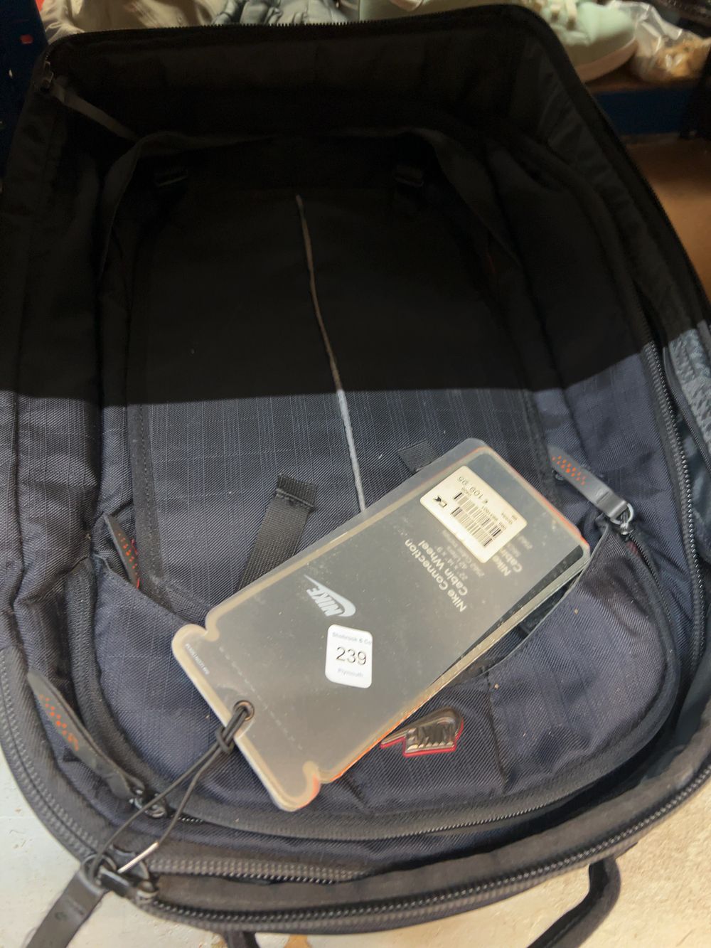 Lot 239: A Collection of Modern Synthetic Textile Travel Luggage and Accessories including Nike and Revelation Examples