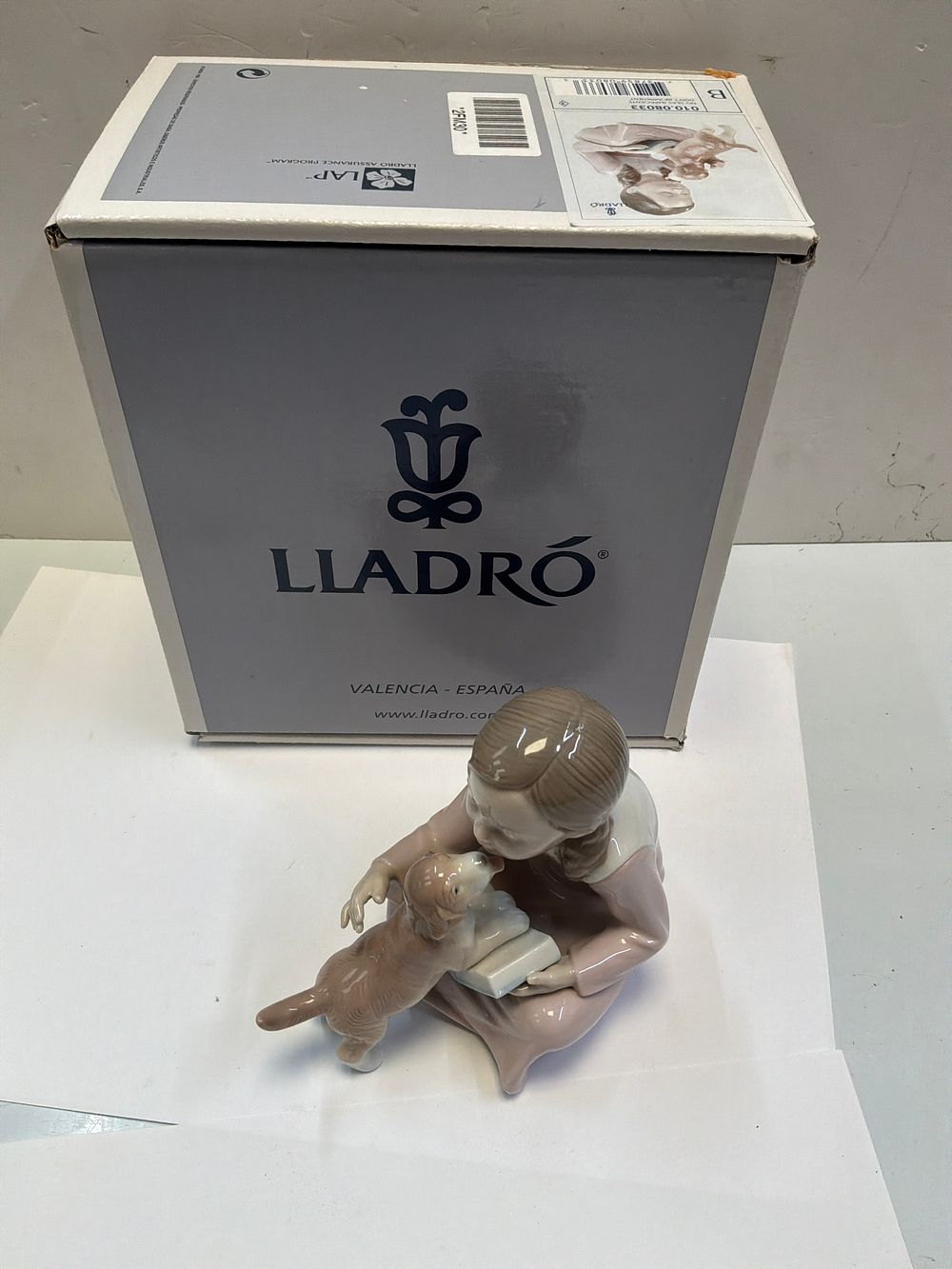 Lot 249: A Lladró Glazed Porcelain Figurine Titled Don't Be Impatient with Original Presentation Box