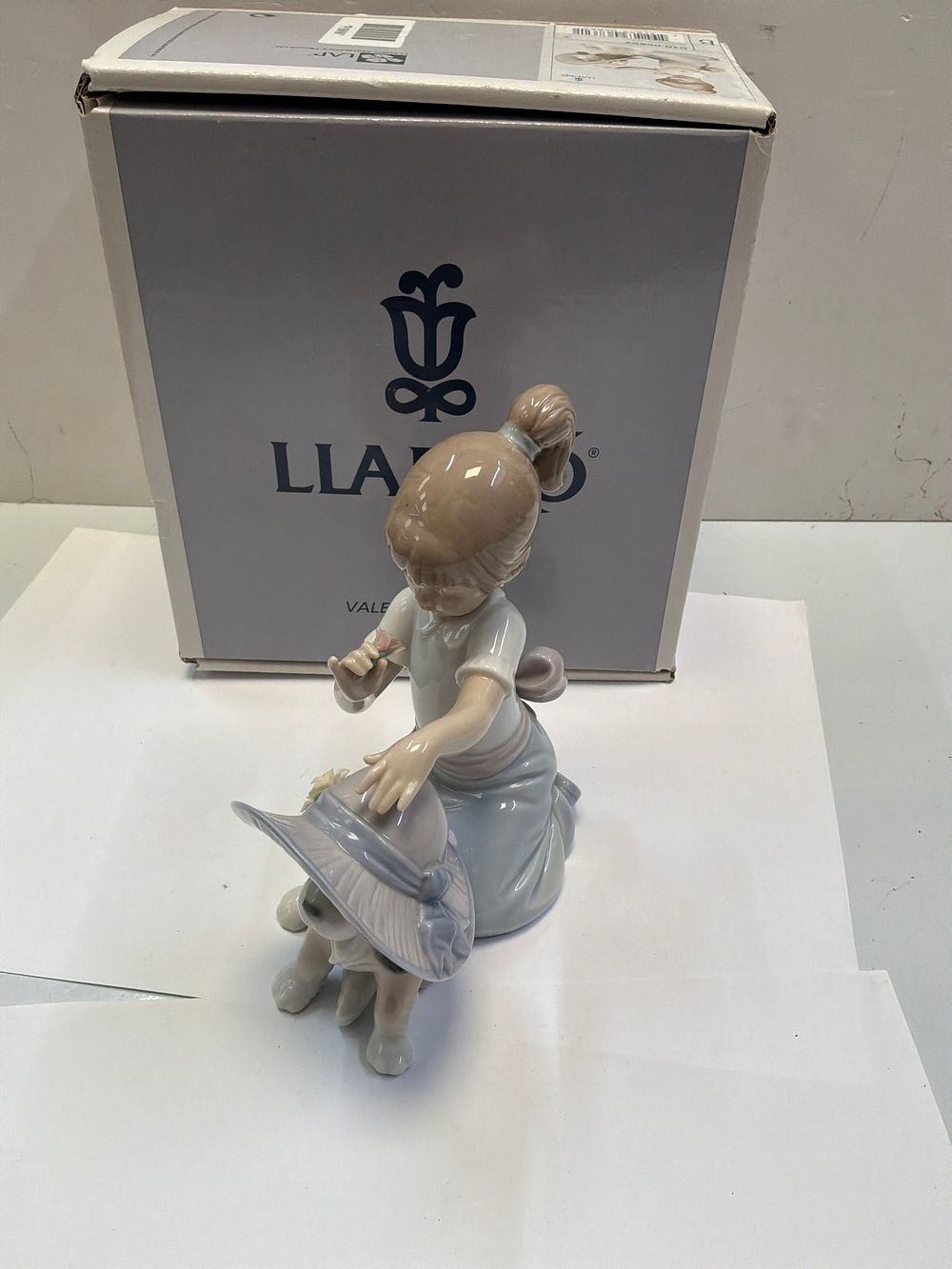 Lot 250: A Lladró Glazed Porcelain Figurine Titled An Elegant Touch with Original Presentation Case