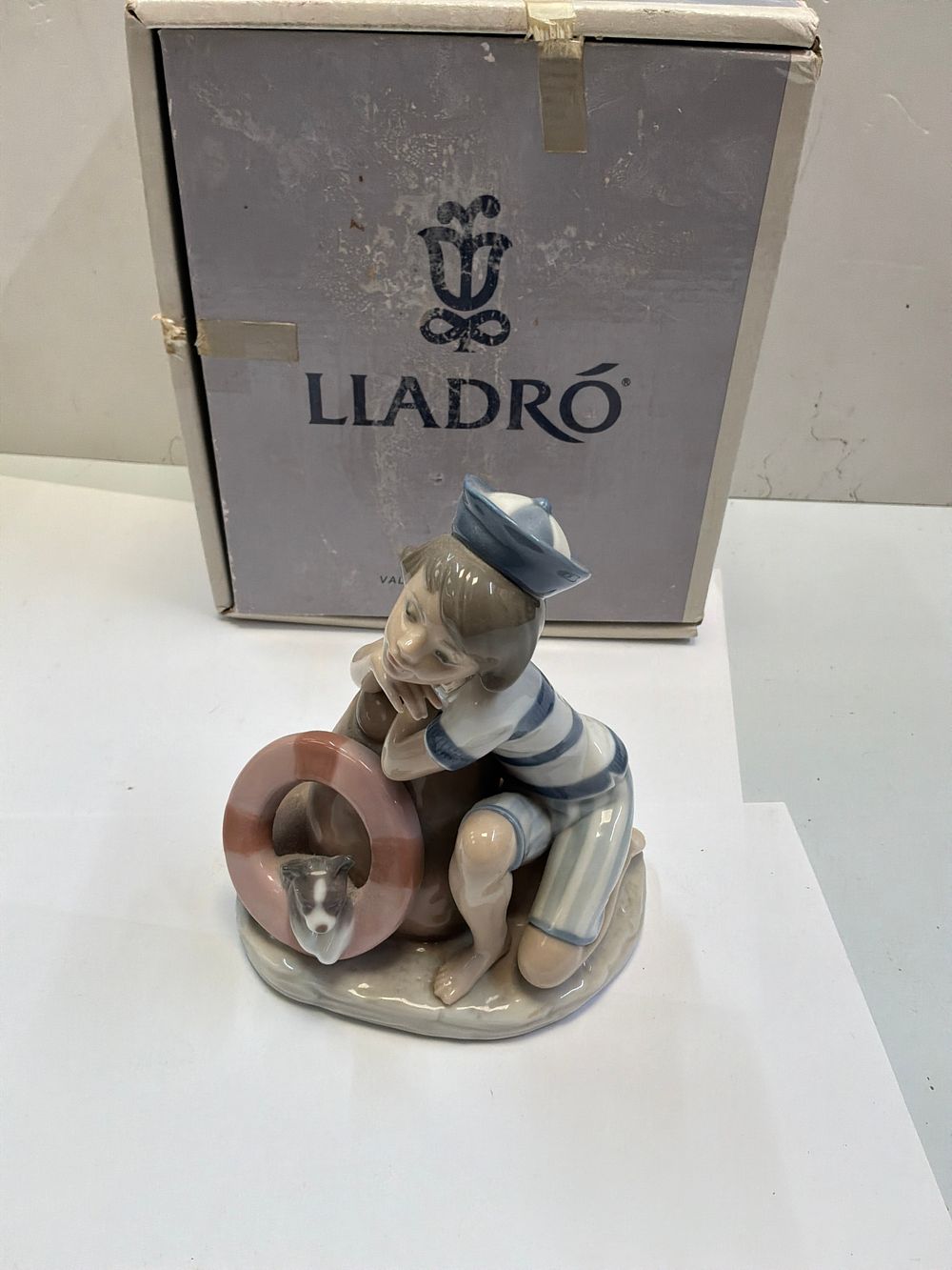 Lot 251: A Lladro Glazed Porcelain Figurine Titled Monday's Child with Original Presentation Box