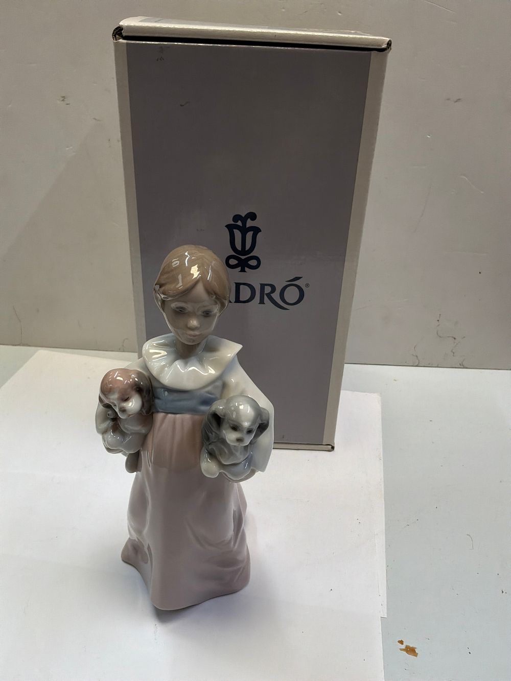 Lot 259: A Lladro Glazed Porcelain Figurine Titled Arms Full of Love with Presentation Case