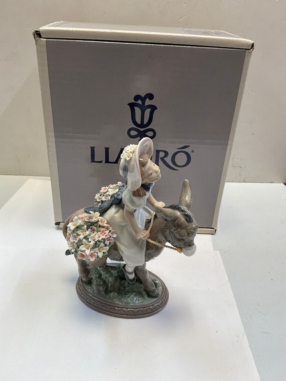 Lot 261: A Lladró Glazed Porcelain Figurine Titled Look At Me with Original Presentation Box