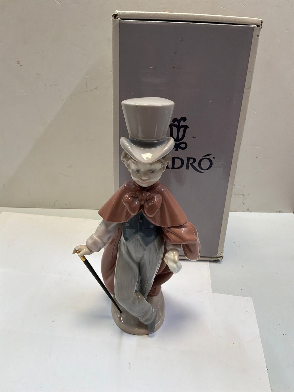Lot 262: A Lladro Polychrome Glazed Porcelain Figurine Titled Out for a Stroll with Original Box