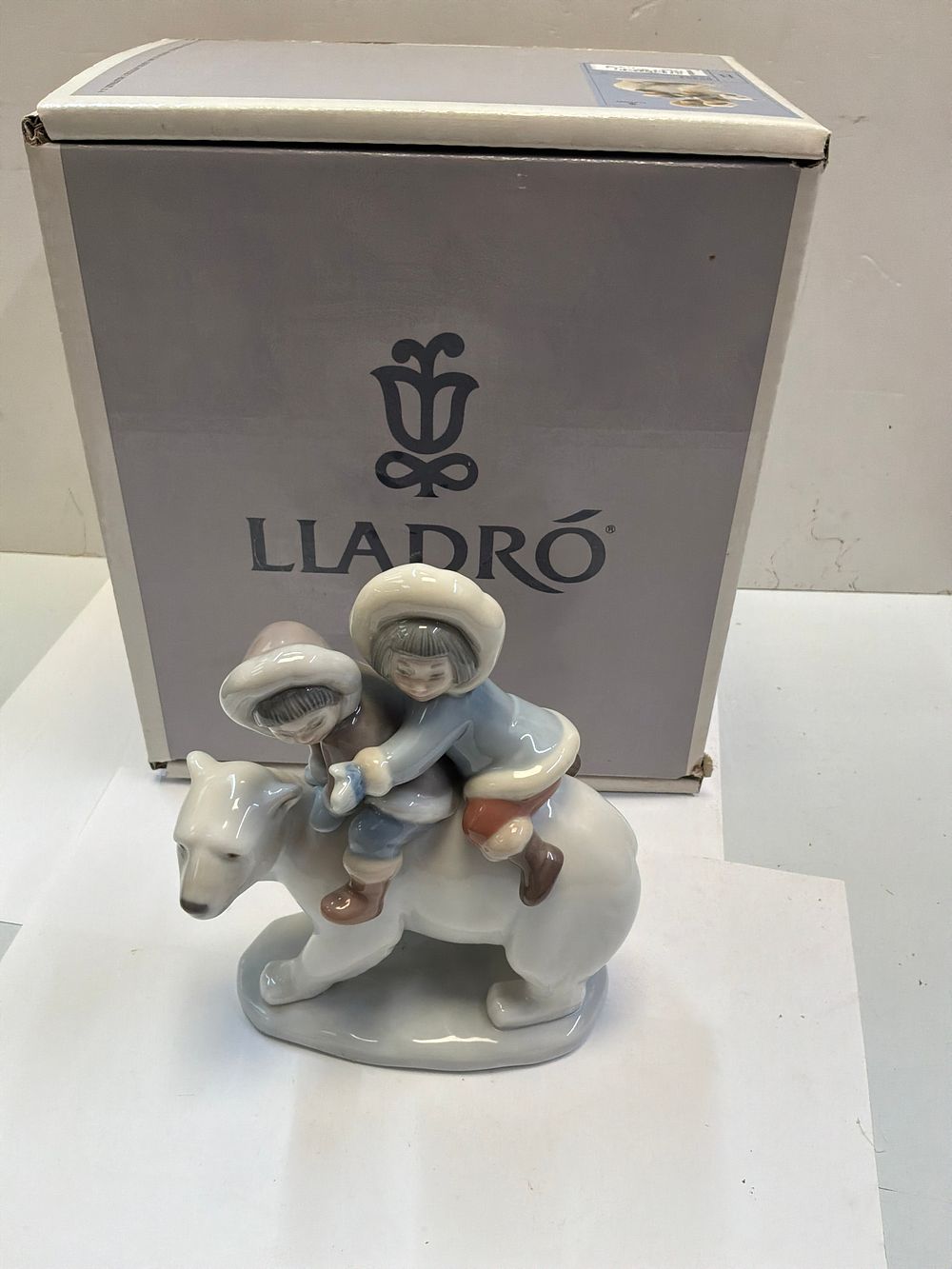 Lot 263: A Lladro Glazed Polychrome Porcelain Eskimo Riders Figurine in Case