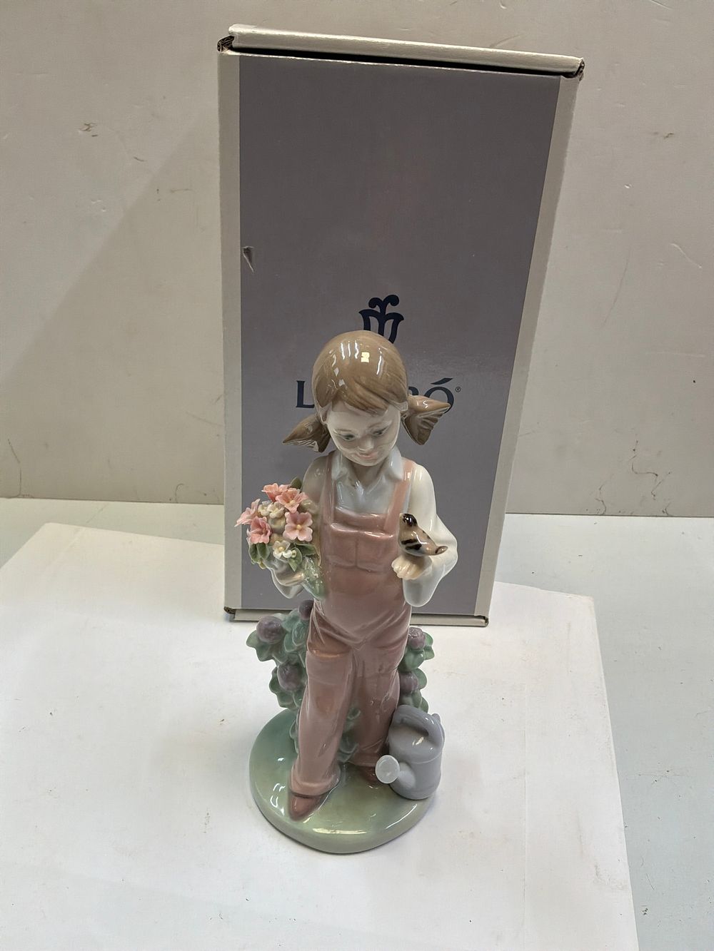 Lot 271: A Lladro Glazed Porcelain Figurine Titled Spring with Original Presentation Box