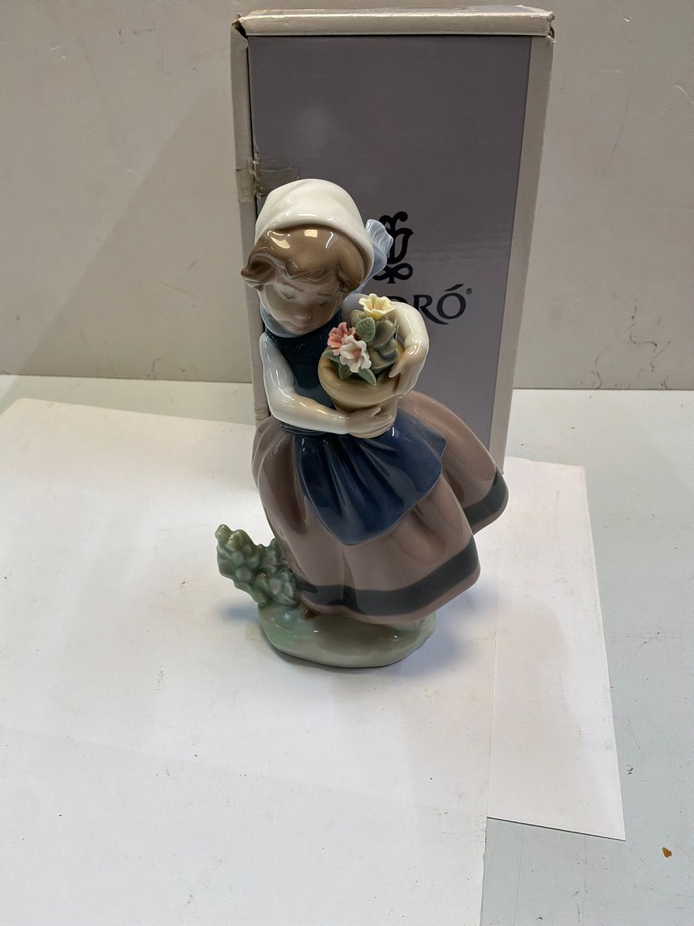 Lot 272: A Lladró Glazed Porcelain Figurine Titled Spring is Here with Original Presentation Box