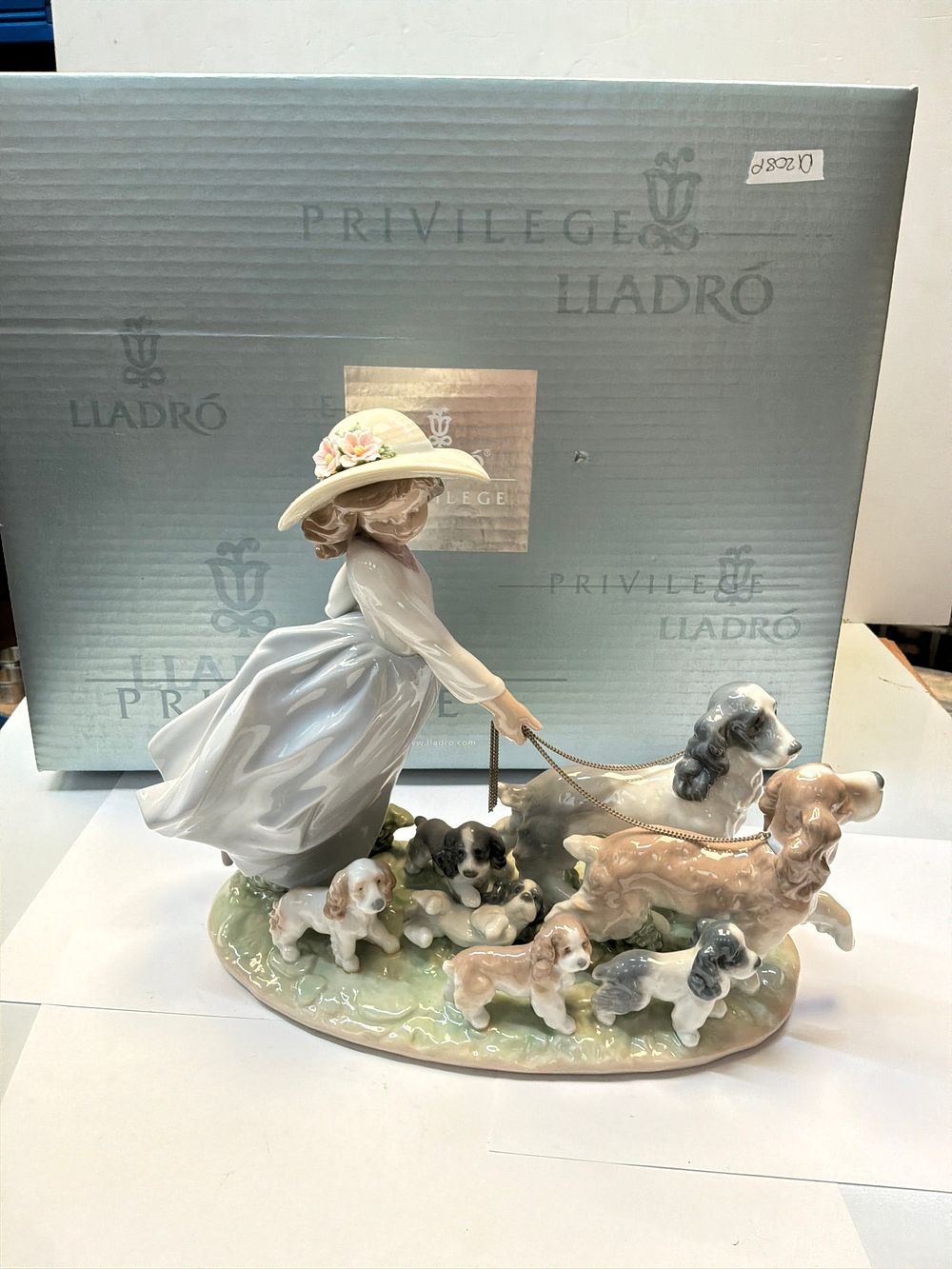 Lot 277: A Lladró Privilege Porcelain Figurine Group Titled A Walk with the Dogs with Presentation Case