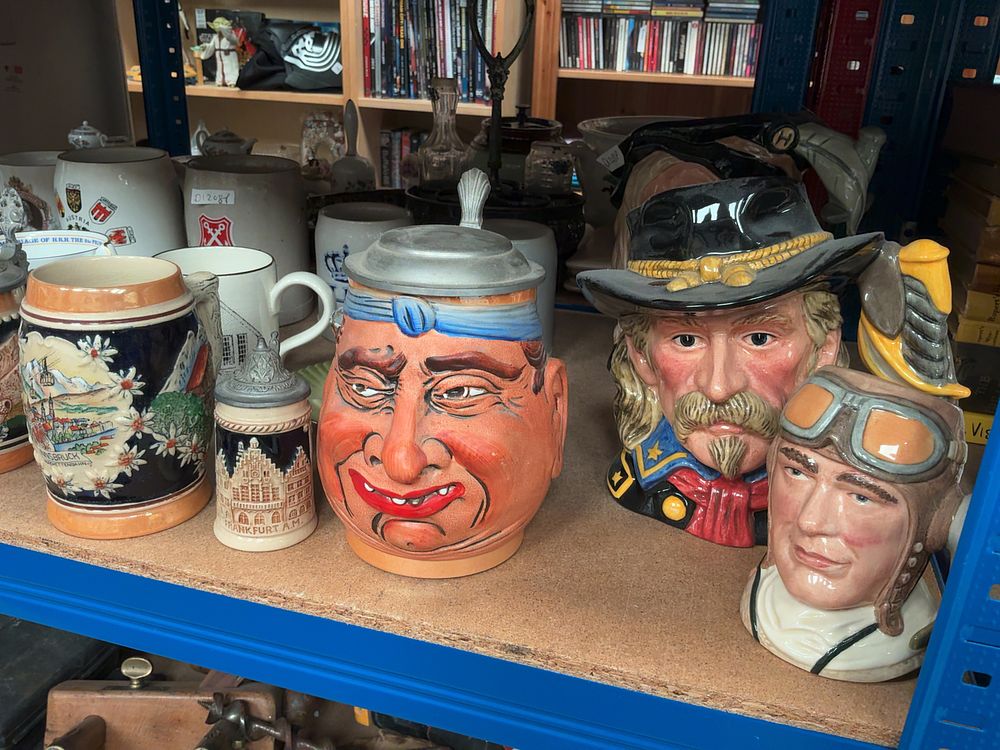 Lot 297: A Collection of Ceramic Character Jugs and Beer Steins including Royal Doulton.