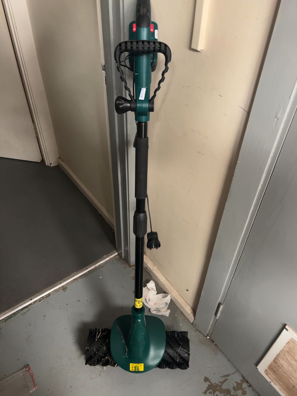 Lot 312: A Plastic and Metal Cordless Artificial Grass Power Brush and Lawn Sweeper