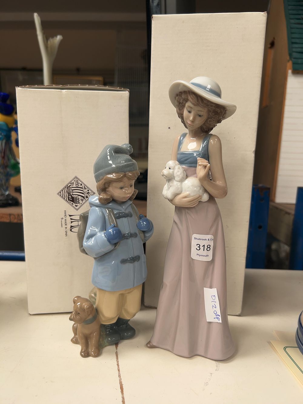 Lot 318: A Group of Two Nao by Lladro Porcelain Figurines with Original Boxes