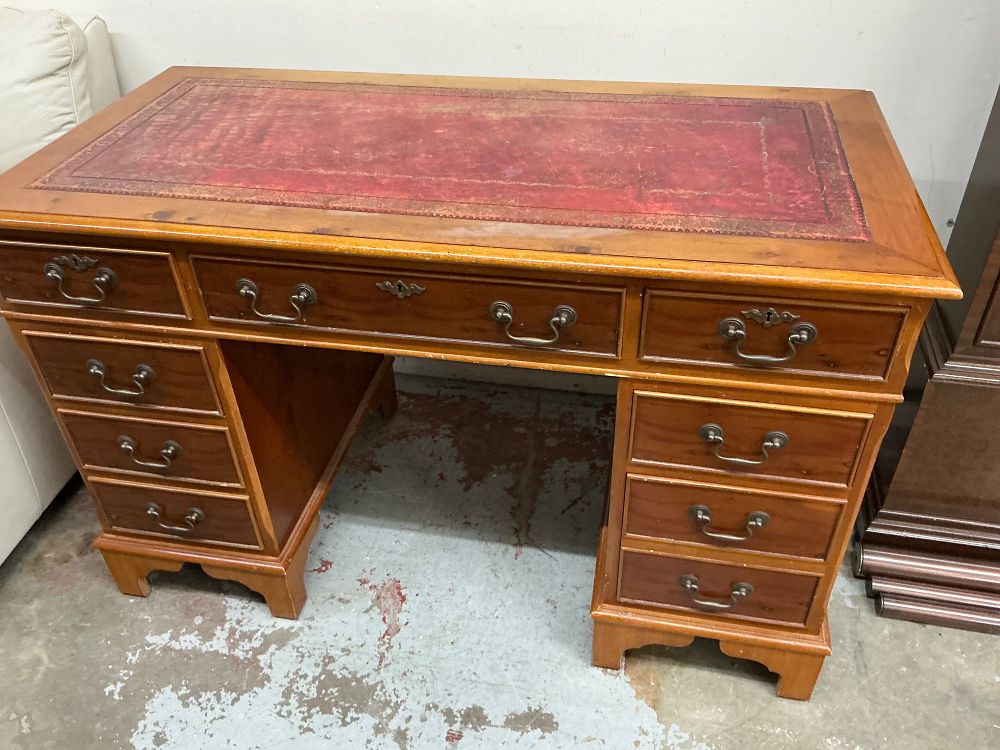 Lot 352: A Georgian Style Stained Pine Twin-Pedestal Desk with Red Leather Top and Original Documentation