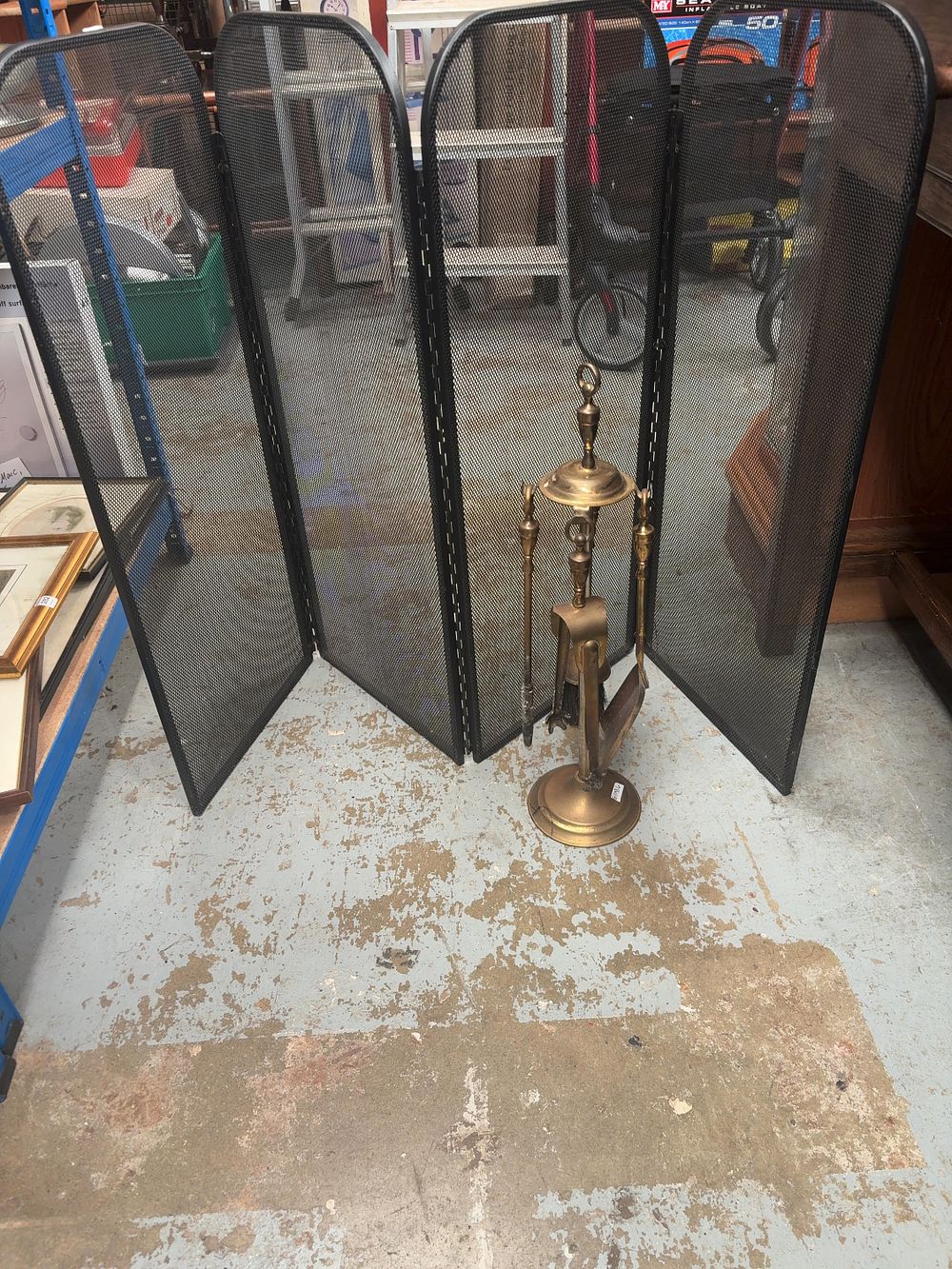 Lot 355: A Collection of Metal and Brass Fireplace Accessories Including a Four-Panel Folding Screen and a Companion Tool Set