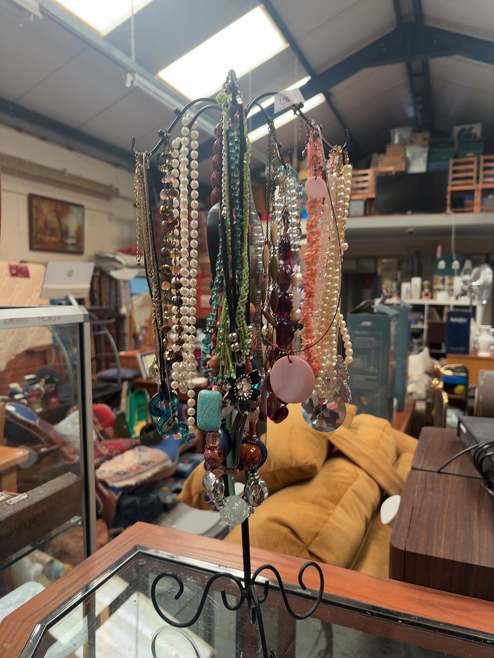 Lot 360: A Collection of Mixed Style Costume Jewellery Necklaces and a Metal Rotating Display Stand