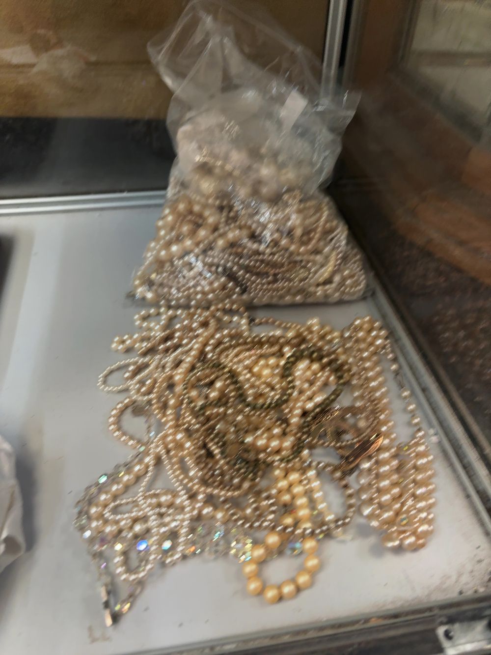 Lot 380: A Collection of Faux Pearl Costume Jewellery Necklaces in Various Styles and Colours