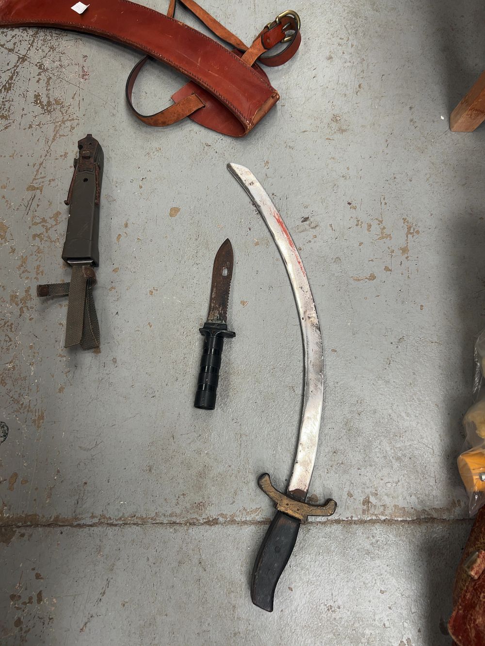 Lot 389: An Assortment of Two Metal and Leather Edged Weapons including a Middle Eastern style dress Sword and a Bayonet