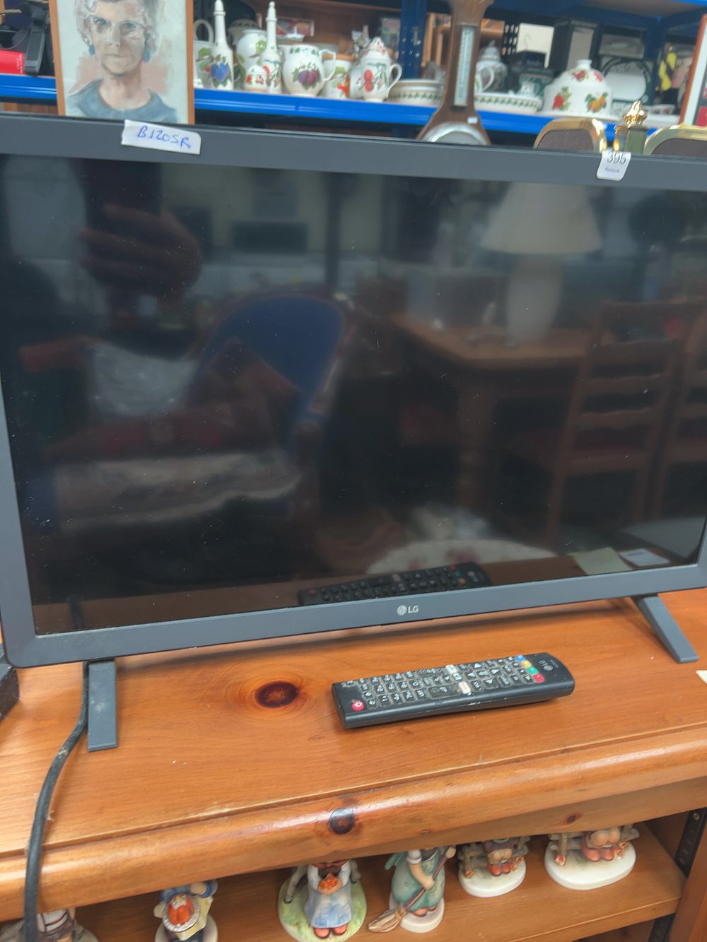 Lot 395_: An LG 24 Inch HD Ready Smart Television with Remote Control