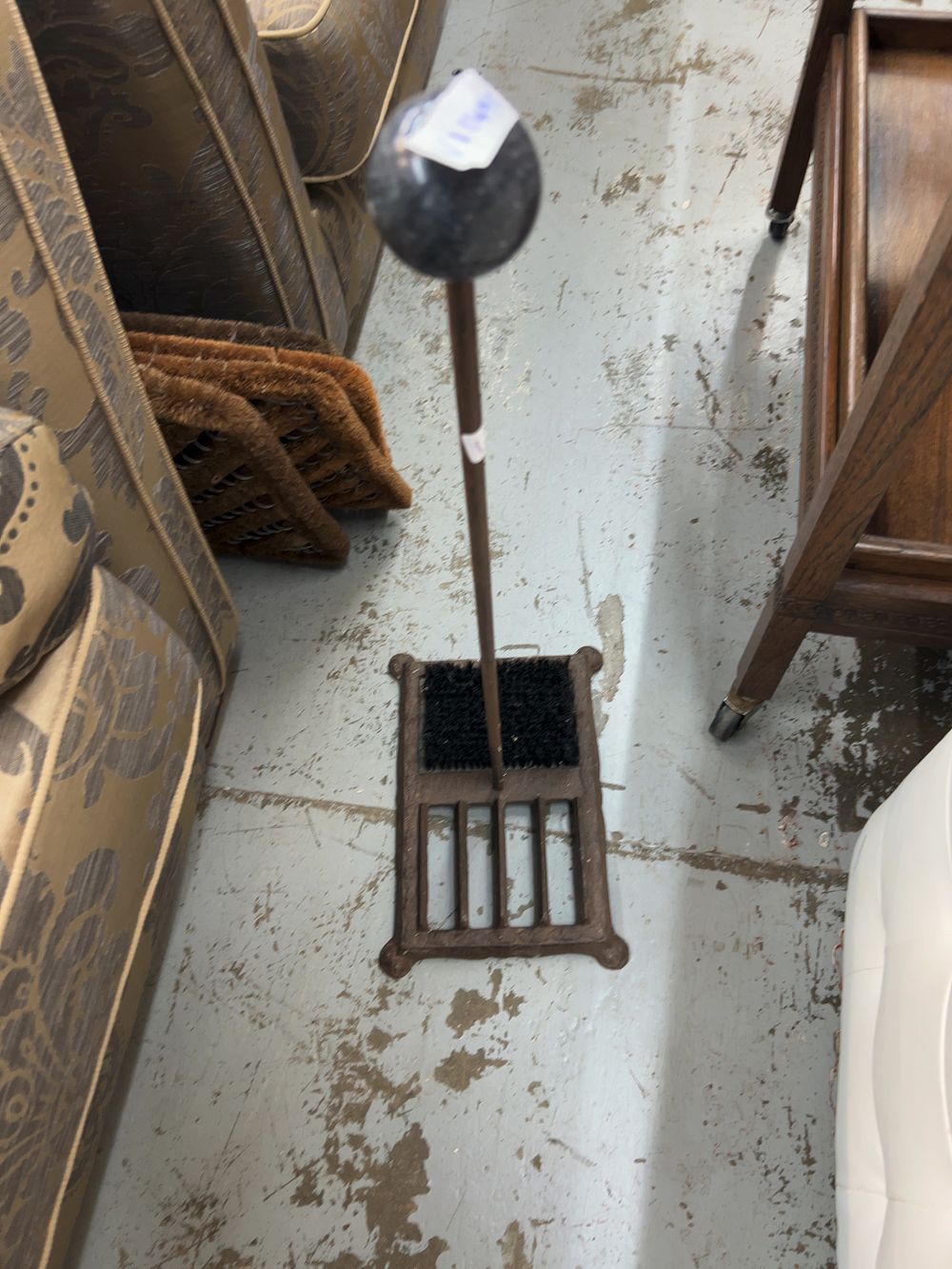 Lot 404: A Cast Iron Boot Scraper and a Collection of Coir Replacement Brushes