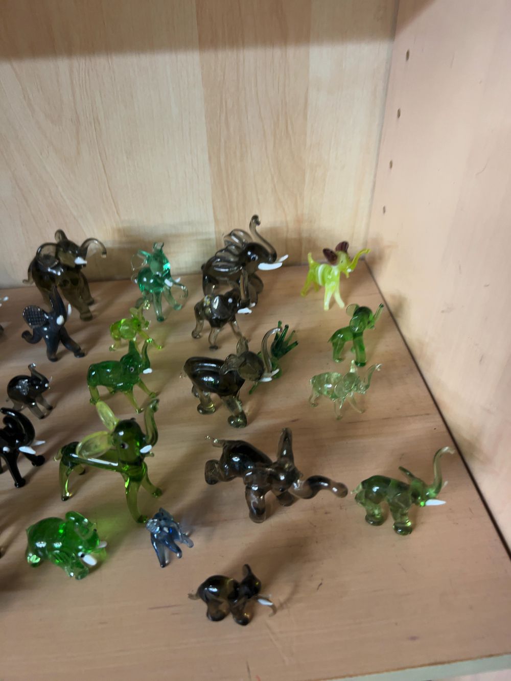 Lot 419: A Collection of Miniature Hand Blown and Lampworked Glass Elephant Figurines