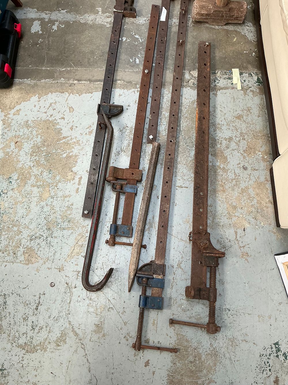 Lot 424: A Collection of Five Vintage Steel and Cast Iron Sash Cramps and Assorted Demolition Tools Including a Sledgehammer