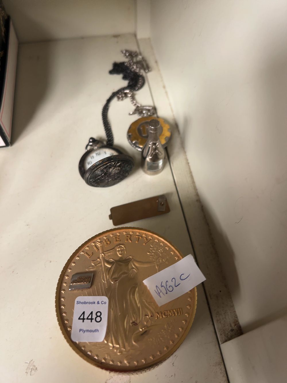 Lot 448: A Collection of four Timepieces and Collectibles including a Bulova US Double Eagle style Desk Clock