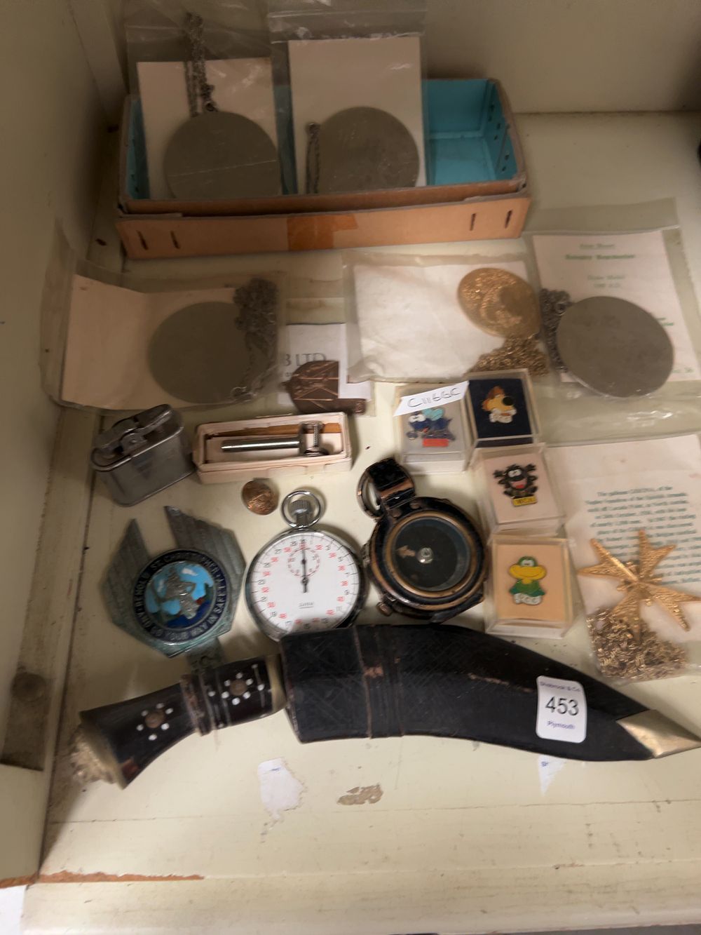 Lot 453: A Collection of Militaria and Collectables including a Liga Stopwatch and MCA Enamel Pins