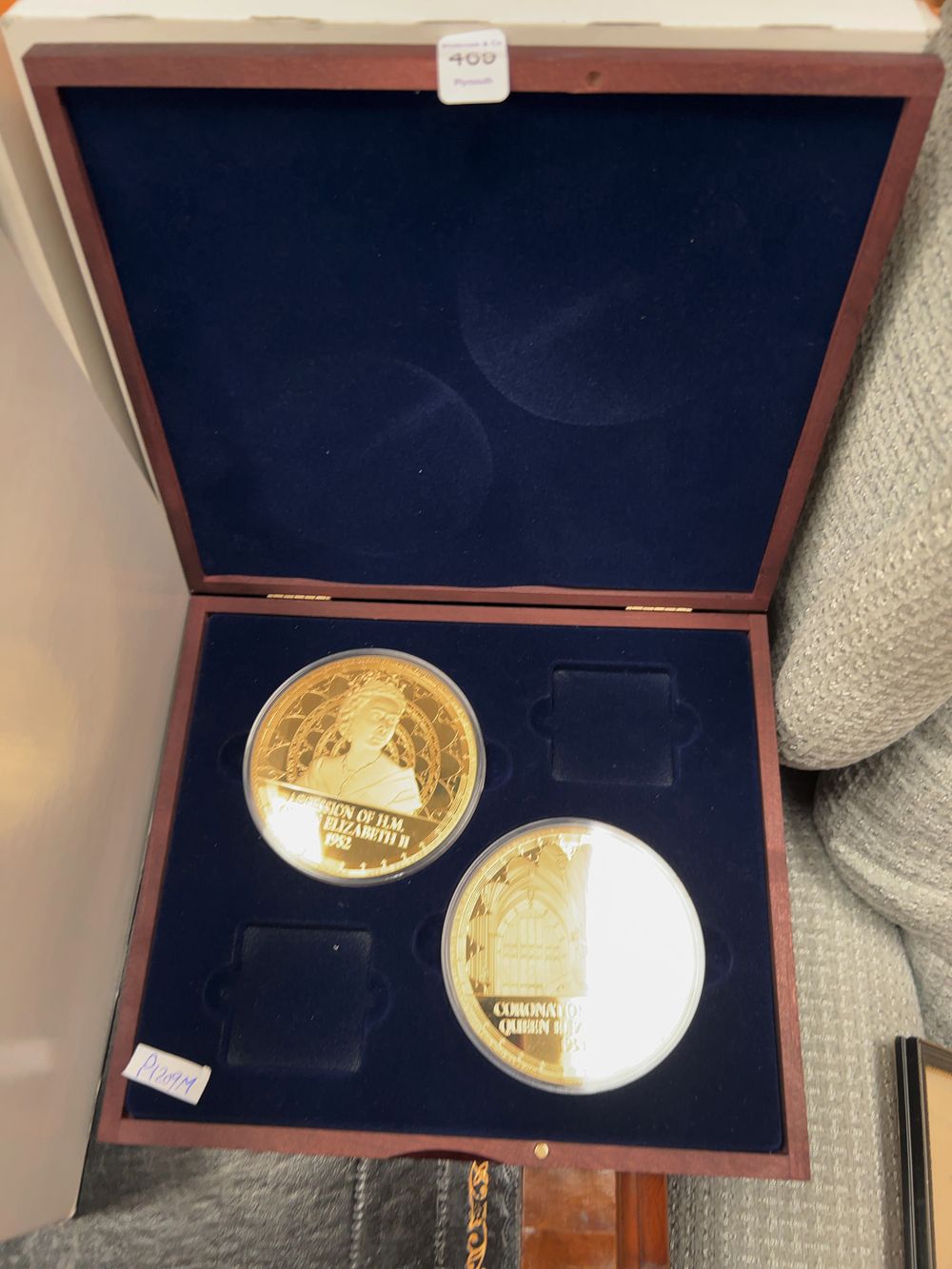 Lot 469: A Set of Two Elizabeth II Accession and Coronation Gold-Plated Commemorative Medals with Presentation Case