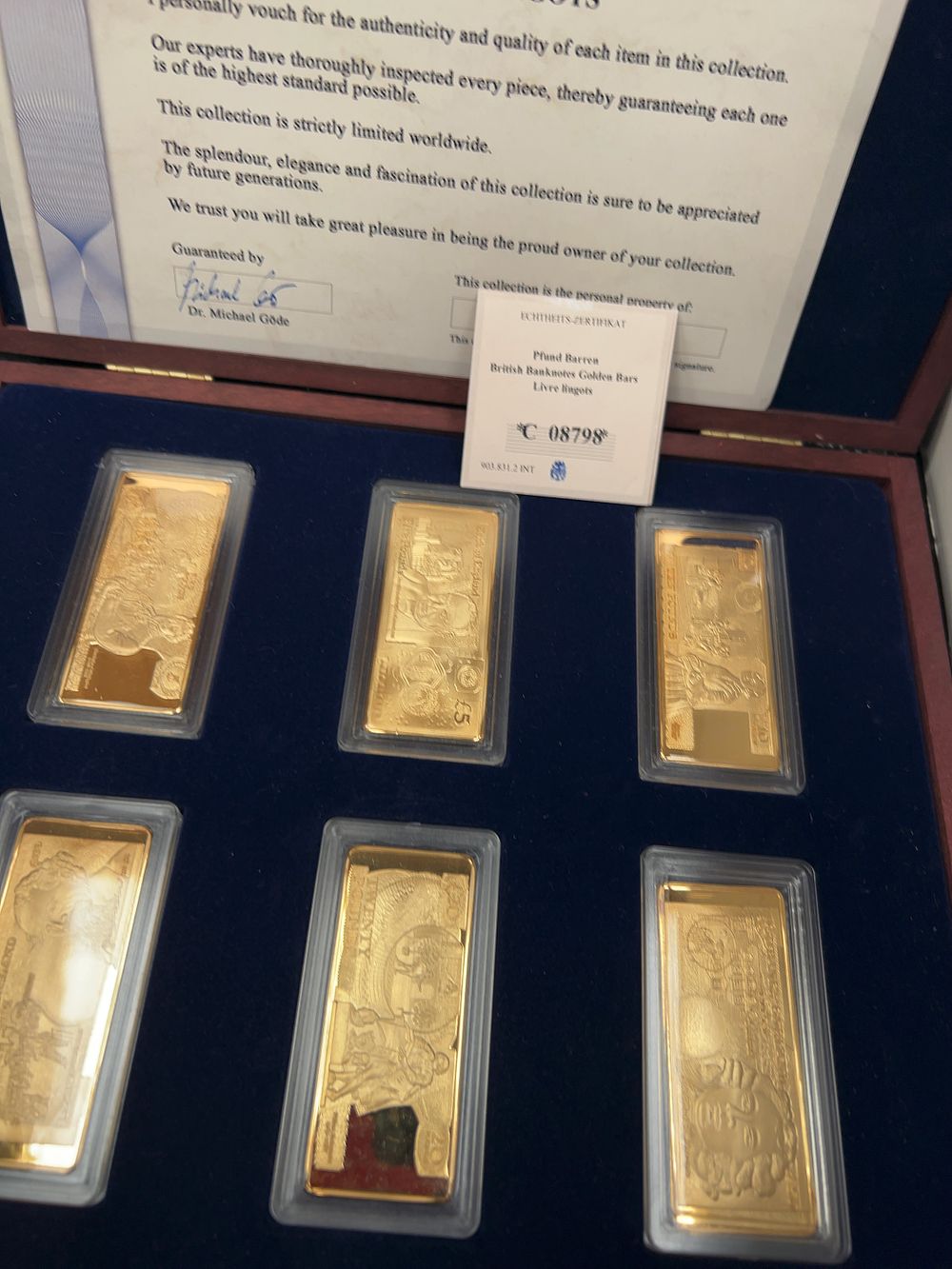 Lot 470: A Set of Six Commemorative Gold-Plated Copper Pounds Ingots with Presentation Case