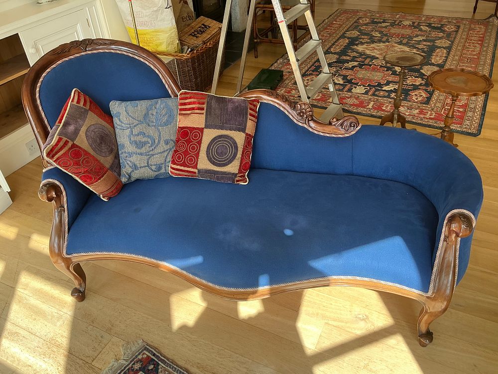 Lot 481: A Victorian Style Carved Hardwood and Blue Upholstered Chaise Longue with Three Scatter Cushions