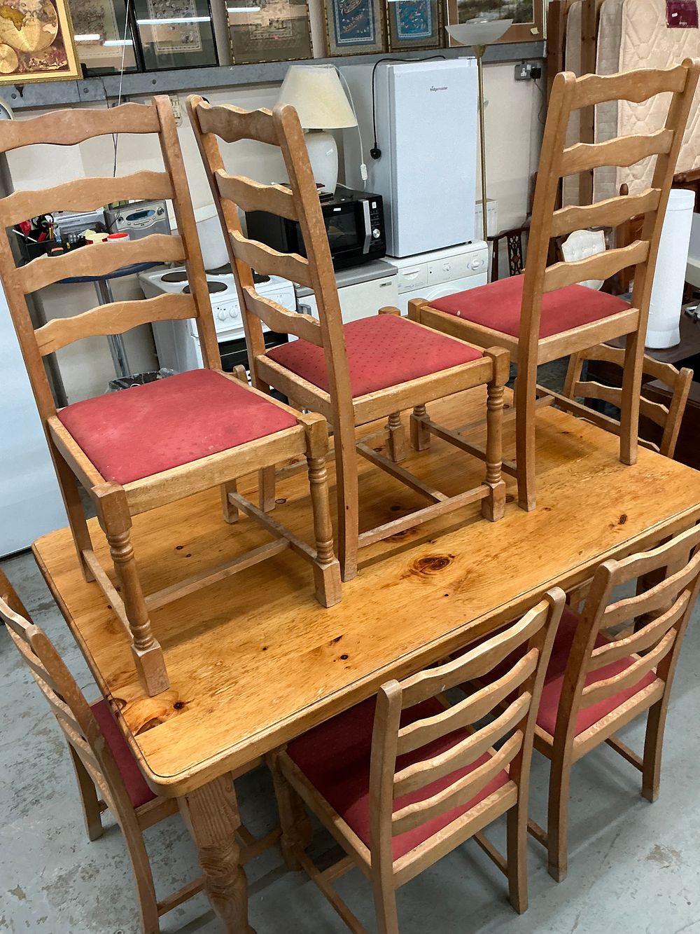 Lot 482: A Ten Piece Farmhouse Style Pine Dining Suite