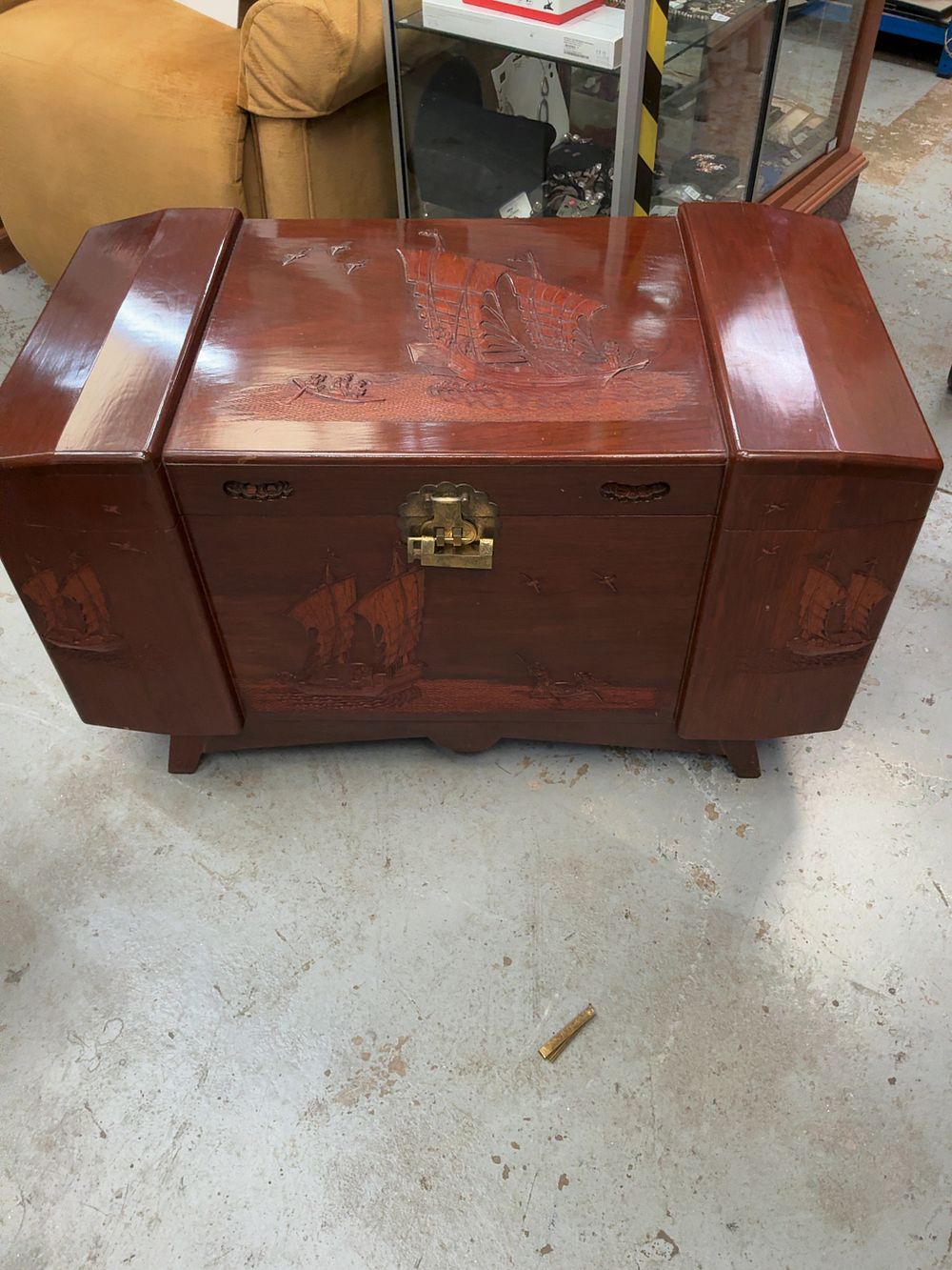 Lot 484: A Mid-20th Century Chinese Style Carved Camphor Wood Stepped Lid Blanket Chest by Shanghai Trading Company Singapore